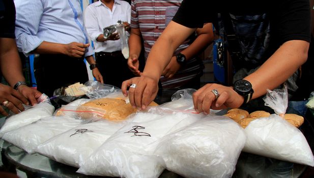 INDONESIA, Medan: Police detectives reveal at a conference that they have busted drug dealers from an international network in the city of Medan, Indonesia on November 3, 2015. A wide array of contraband are on display, reportedly including 12 kg of methamphetamine and 37,000 ecstasy pills, along with scales and weapons. The drugs on display are believed to be of Chinese origin, and the suspect is thought to have been operating in the area for at least six months.