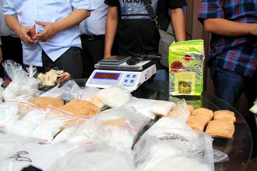 INDONESIA, Medan: Police detectives reveal at a conference that they have busted drug dealers from an international network in the city of Medan, Indonesia on November 3, 2015. A wide array of contraband are on display, reportedly including 12 kg of methamphetamine and 37,000 ecstasy pills, along with scales and weapons. The drugs on display are believed to be of Chinese origin, and the suspect is thought to have been operating in the area for at least six months.