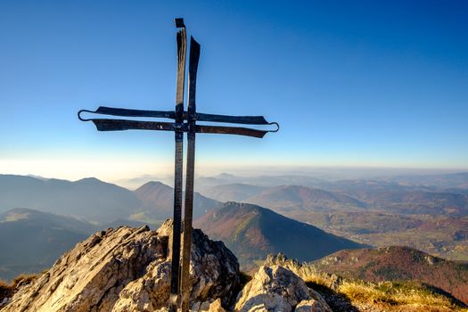 Scenic landscape view of mountain peak Rozsutec with metal cross, Mala Fatra, Slovakia