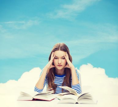 education and home concept - stressed student girl with books