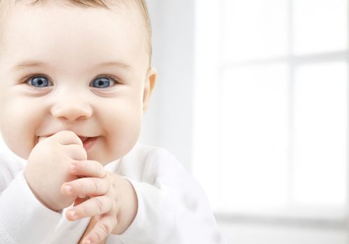 child, happiness and people concept - adorable baby