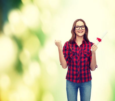 education concept - smiling female student in eyeglasses with diploma