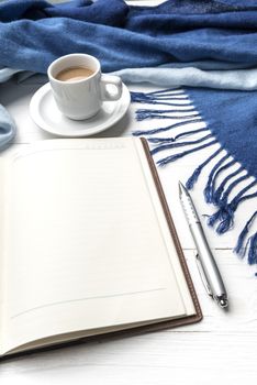 coffee and scarf background on white table