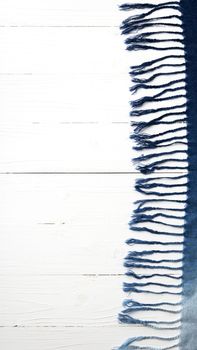 blue scarf over white wood table background