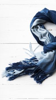 blue scarf over white wood table background