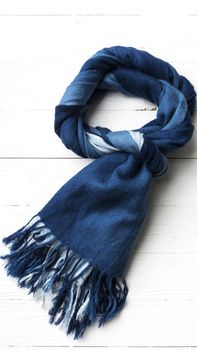 blue scarf over white wood table background