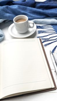 coffee and scarf background on white table