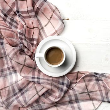 coffee and scarf background on white table