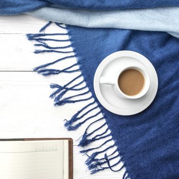 coffee and scarf background on white table