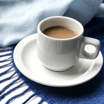 coffee and scarf background on white table