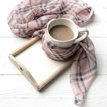 coffee and scarf background on white table