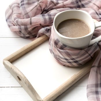 coffee and scarf background on white table