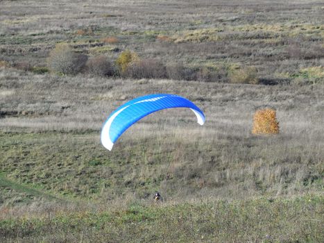 land occupations paraglider pilot, raising paraglider