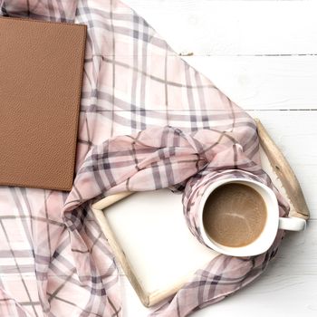 coffee and scarf background on white table