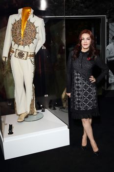 UK, London: Priscilla Presley has showcased Elvis memorabilia at a new exhibition at the 02 Arena in London, on November 3, 2015. The Aztec Sundial Suit worn by the King during his last performance can be seen along with over 300 other artefacts, including cars, guitars and iconic stage costumes. The Elvis at the O2 exhibition chronicles the rise of the rock 'n' roll icon and will be open to the public on December 12, 2015.