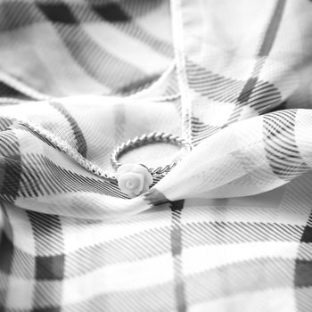 ring on scarf background black and white color