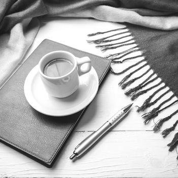 coffee and scarf background on white table black and white color