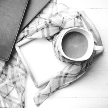 coffee and scarf background on white table black and white color