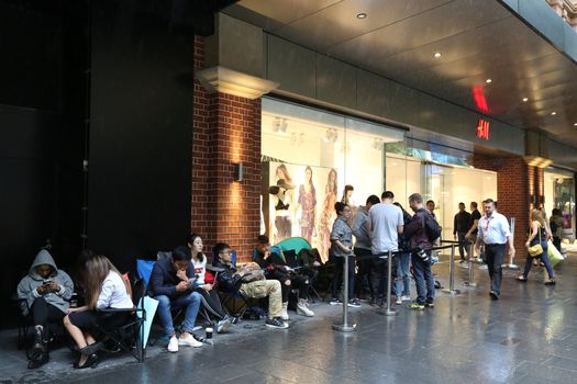 AUSTRALIA, Sydney: A queue forms outside the H&M store in Pitt Street Mall, Sydney on November 4, 2015 ahead of the official launch of the Balmain X H&M fashion range on November 5, 2015.