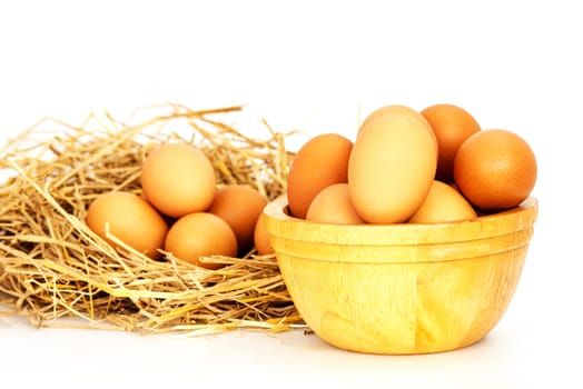 Egg, Chicken Eggs in a basket and a bowl isolate on white