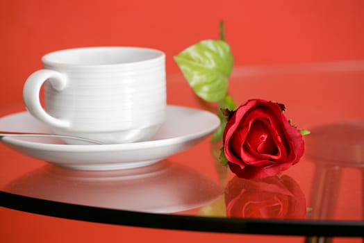 Cup of coffee on table on light background