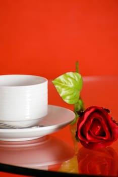 Cup of coffee on table on light background