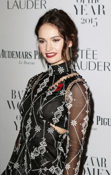 UNITED KINGDOM, London: Lily James poses during the Harper's Bazaar Women of the Year Awards at Claridge's, in London, on November 3, 2015.