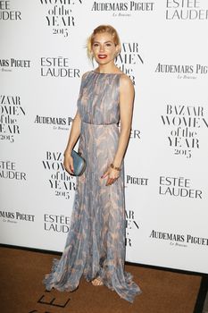 UNITED KINGDOM, London: Sienna Miller poses during the Harper's Bazaar Women of the Year Awards at Claridge's, in London, on November 3, 2015.