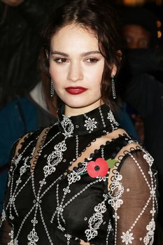 UNITED KINGDOM, London: Lily James poses during the Harper's Bazaar Women of the Year Awards at Claridge's, in London, on November 3, 2015.