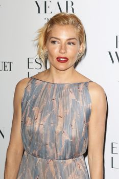 UNITED KINGDOM, London: Sienna Miller poses during the Harper's Bazaar Women of the Year Awards at Claridge's, in London, on November 3, 2015.