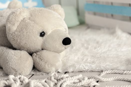 white soft toy bear in a children's room