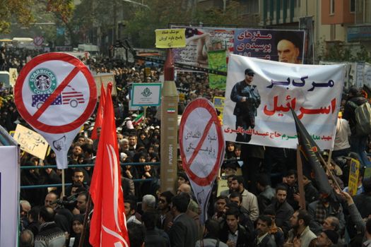 IRAN, Tehran: Hundreds of people march in front of the former US embassy in Tehran, during the '13 Aban' (4th of November in english), on November 4, 2015, to commemorate the anniversary of the 1979 US embassy taking and protest against the United States of America.