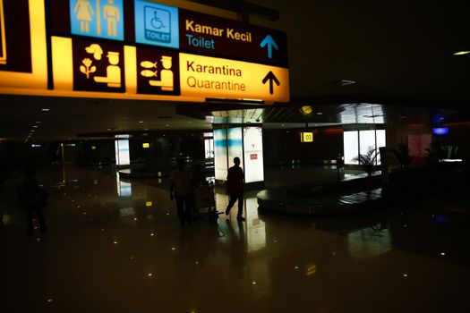 INDONESIA, Denpasar: Passengers wait for information on delayed and cancelled flights at the international departure area of Bali's Ngurah Rai Airport in Denpasar on November 4, 2015. Indonesia will extend the closure of an international airport on popular Bali resort island to on November 5 due to ash from an erupting volcano, an official said on November 4, grounding more than 100 flights. 