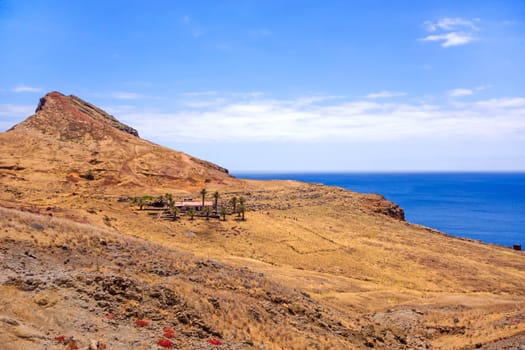 Mountainous landscape / lonely house / ranch with palms - peninsula Ponta de Sao Lourenco - east of Madeira