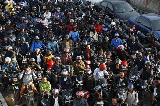 NEPAL, Kathmandu: Motorists wait in a queue for petrol near a petrol station in Kathmandu on November 4, 2015. Nepal signed a deal last week with China to import petroleum products, its embassy in Beijing said, as the Himalayan nation tries to boost supplies to deal with a deepening fuel crisis. The curfew imposed in Birgunj, Nepal after violent protests where one person was killed near the Shankaracharya Gate close to the Nepal-India border on Monday causing tight security for goods to arrive.
