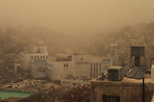 JORDAN, Amman : A thick sandstorm cloak the Jordan capital city Amman in Othman Bin Affan street and other regions in the Middle East on November 4, 2015, disrupting travel for the US first lady. 