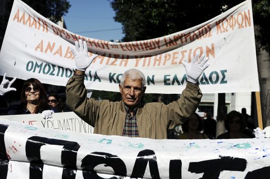 GREECE, Athens: Disabled persons take part in a protest in Athens on November 4, 2015 to condemn the new planned cuts to their pensions and allowances. These cuts form part of the requirements of the country's creditors.