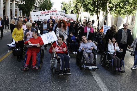 GREECE, Athens: Disabled persons take part in a protest in Athens on November 4, 2015 to condemn the new planned cuts to their pensions and allowances. These cuts form part of the requirements of the country's creditors.