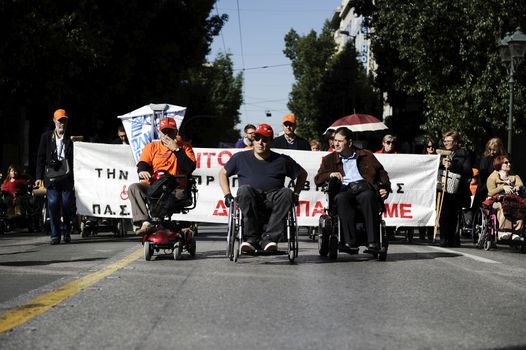GREECE, Athens: Disabled persons take part in a protest in Athens on November 4, 2015 to condemn the new planned cuts to their pensions and allowances. These cuts form part of the requirements of the country's creditors.