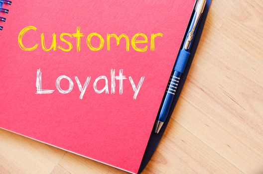 Customer loyalty text concept write on notebook