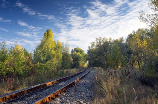 Industrial landscape - old abandoned railway receding into the distance