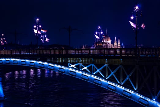 Margaret Bridge over Danube river and parliament Hungary  by night, Budapest, Hungary