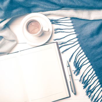 coffee and scarf background on white table vintage style