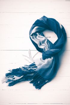 blue scarf over white wood table background vintage style