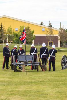 CALGARY, CANADA - JUN 13: Exhibits outside the Military Museums in Calgary, Alberta Canada. It is made of museums dedicated to representing Canada's navy, army, and air force. Soldiers with cannon.