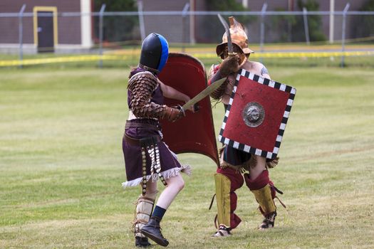 CALGARY CANADA JUN 13 2015:  The Military Museum organized "Summer Skirmish" event where an unidentified soldier is seen  in a historical Reenactment Battle. Gladiator fight.