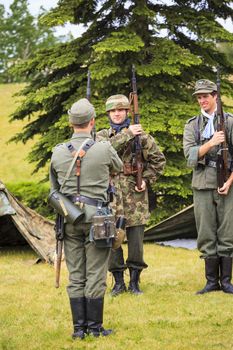 The Military Museum organized "Summer Skirmish" event where an unidentified soldier is seen in a historical Reenactment Battle. German and US soldiers in uniform.