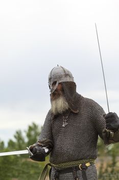 CALGARY CANADA JUN 13 2015: The Military Museum organized "Summer Skirmish" event where an unidentified soldier is seen in a historical Reenactment Battle. Viking solder in action.