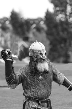 CALGARY CANADA JUN 13 2015: The Military Museum organized "Summer Skirmish" event where an unidentified soldier is seen in a historical Reenactment Battle. Viking solder in action.