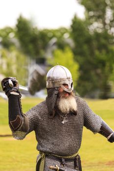 CALGARY CANADA JUN 13 2015: The Military Museum organized "Summer Skirmish" event where an unidentified soldier is seen in a historical Reenactment Battle. Viking solder in action.